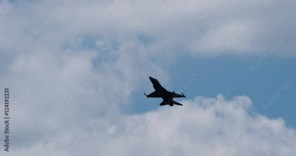 Tracking shot of fighter jet flying in the sky Tracking shot of fighter jet flying in the sky