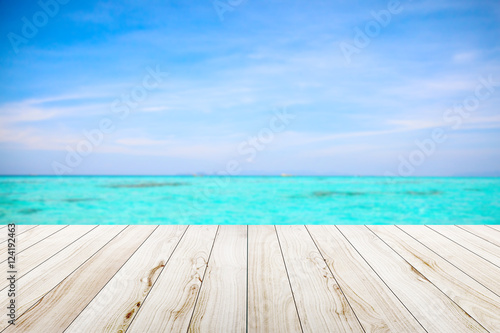 Wood table top on beach background. © Bluesky60
