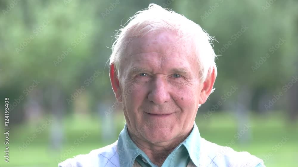 Senior man winking. Old male with gray hair. Make a slight hint. Glance into the right direction. Senior man winking. Old male with gray hair. Make a slight hint. Glance into the right direction.