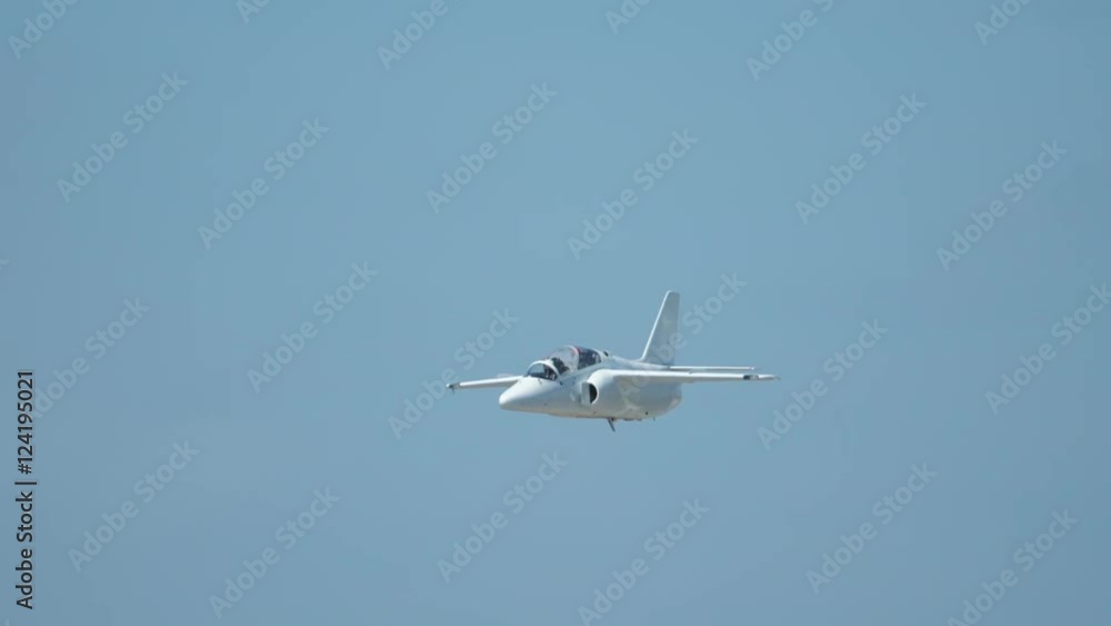 Slow motion of fighter jet flying in blue sky Slow motion of fighter jet flying in blue sky