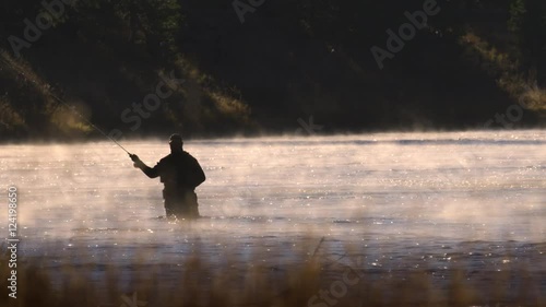 Fisherman fly fishing in river at Yellowstone National Park