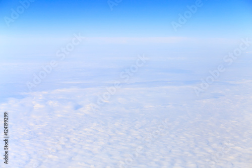 View from airplane on white clouds