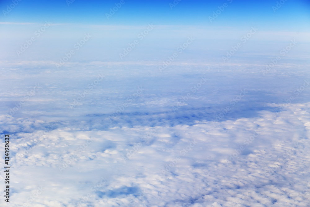 View from plane on white clouds