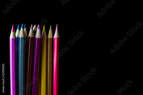 Color pencil on black background with copy space