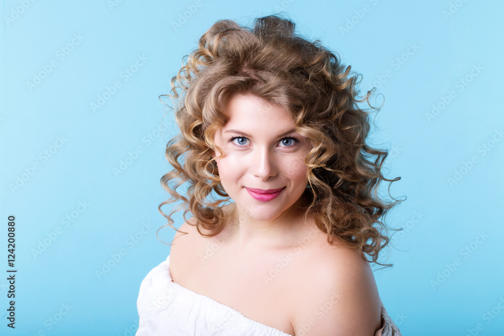 Portrait beautiful woman with curly hair. Model size Plus.