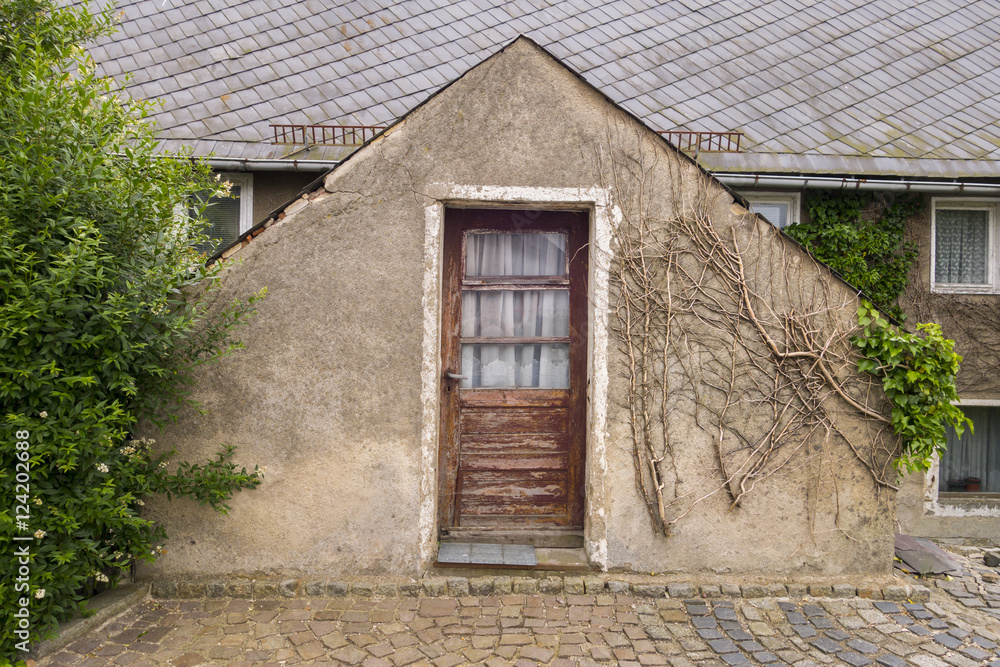 Wooden door of an ancient house Wooden door of an ancient house