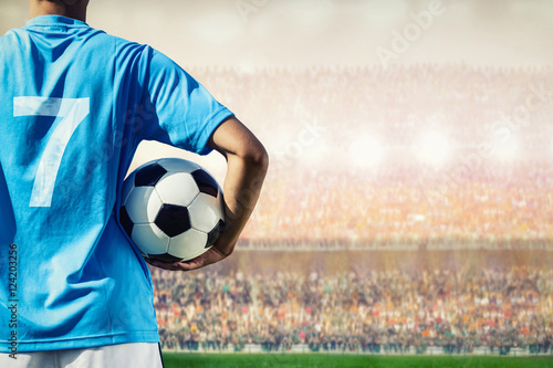 soccer football player in blue team concept holding soccer ball