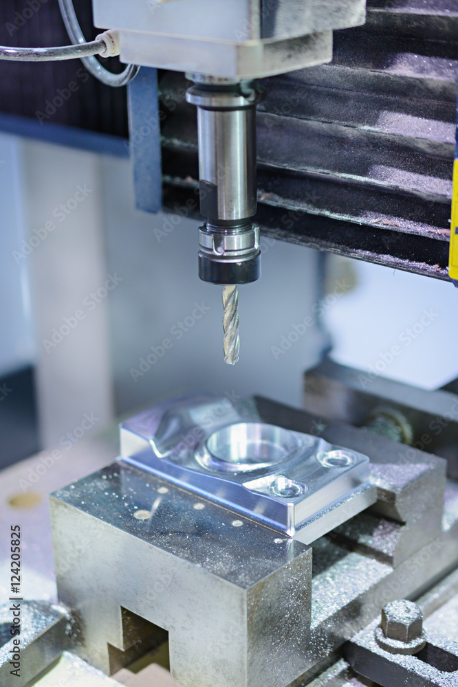 CNC milling machine during operation. CNC milling machine during operation.