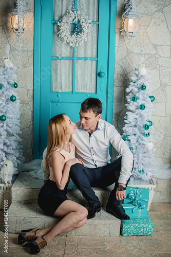 loving couple on a background of the Christmas interior © frizza