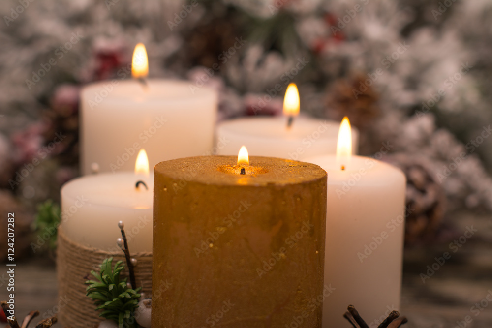 Fir branch in snow, lighted candle, cone on wooden background. Christmas theme Fir branch in snow, lighted candle, cone on wooden background. Christmas theme