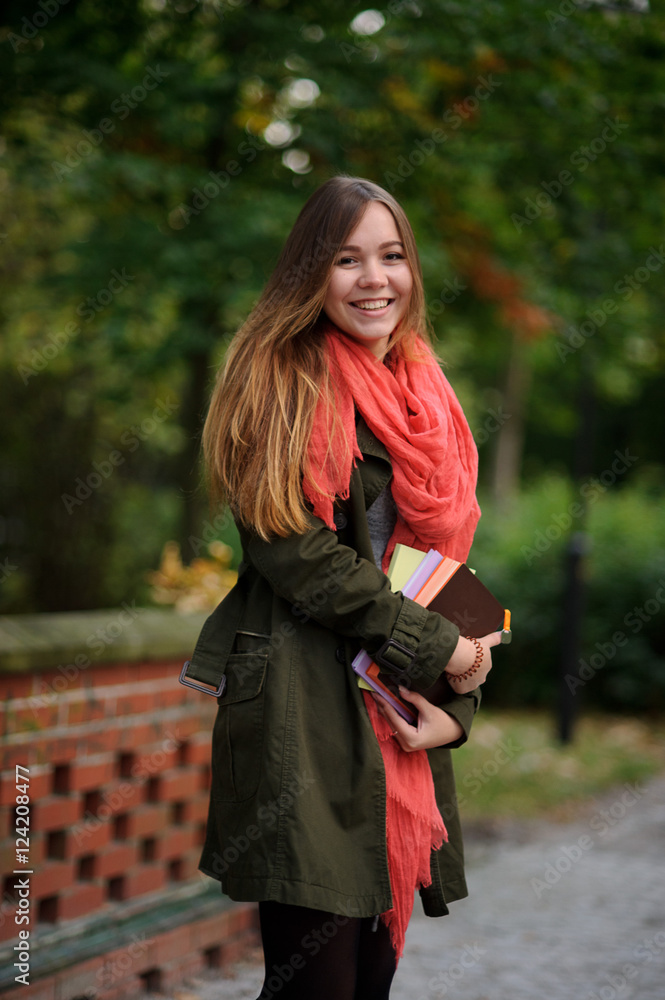 Charming student in a beautiful autumn park. Charming student in a beautiful autumn park.
