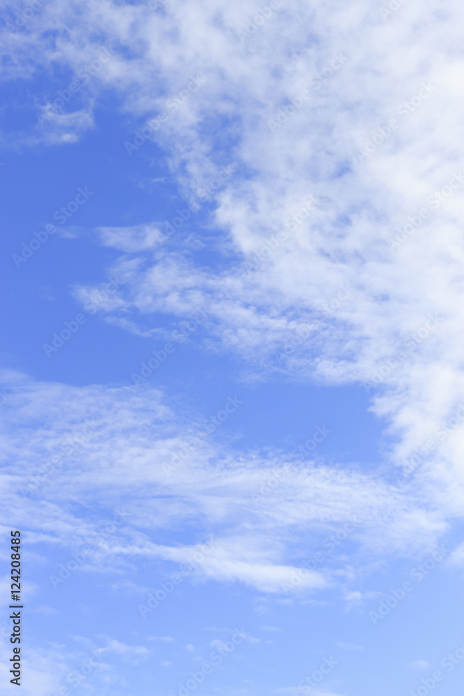 clouds in the blue sky background. over light