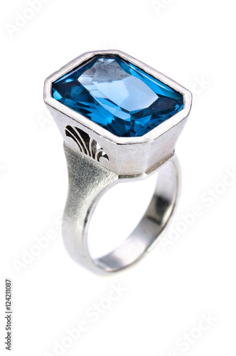 Silver ring with blue gem on an isolated white background