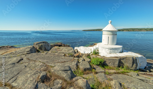 Swedish summer sea coast view with lighthouse