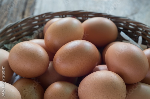 Egg in basket on natural wood,Fresh eggs.