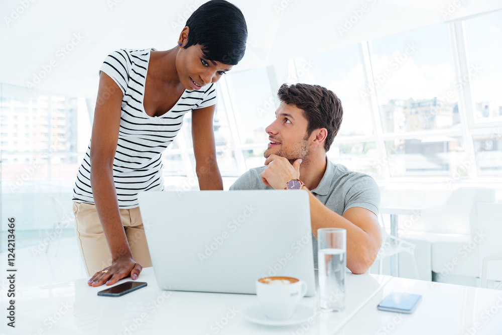Group of two young businesspeople working together in conference room