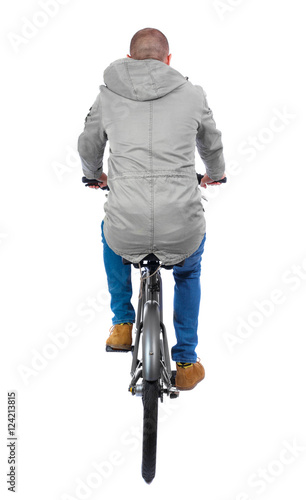 Φωτογραφία back view of a man with a bicycle