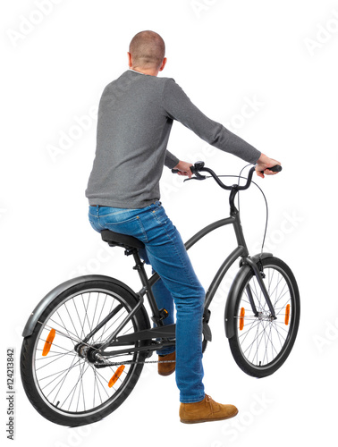 back view of a man with a bicycle. cyclist sits on the bike. Rear view people collection. backside view of person. Isolated over white background.
