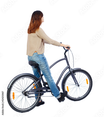 back view of a woman with a bicycle. cyclist sits on the bike. Rear view people collection. backside view of person. Isolated over white background.