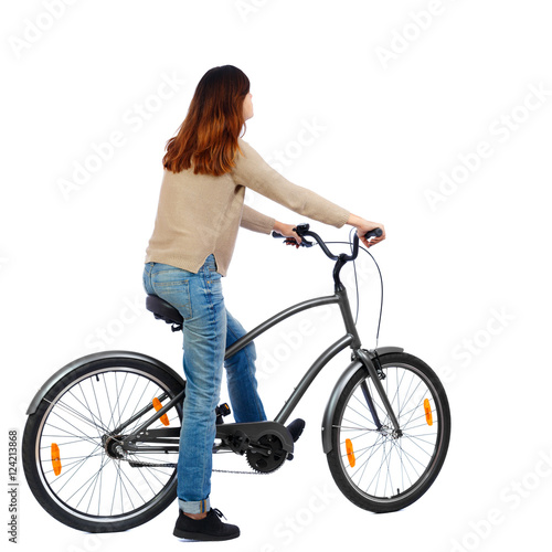 back view of a woman with a bicycle. cyclist sits on the bike. Rear view people collection. backside view of person. Isolated over white background.