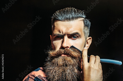 Fotografie Young man with razor