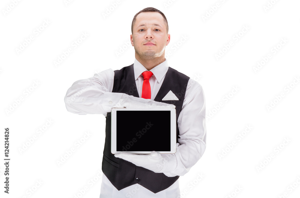 Handsome young waiter in gloves and red cravat holding tablet Handsome young waiter in gloves and red cravat holding tablet