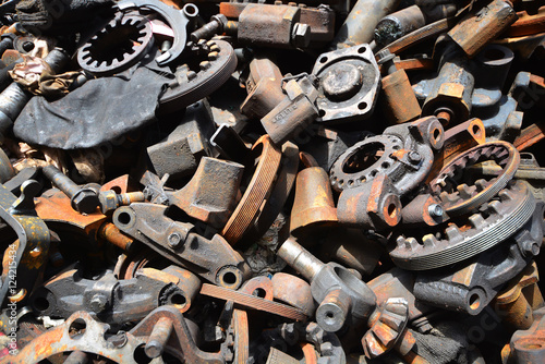 Pile of old motor parts scrap metal for recycling photo