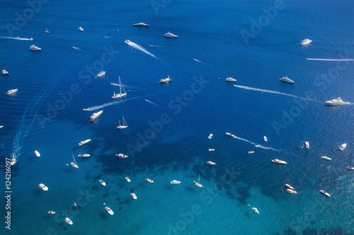 Many yachts and boats on the sea near Capri Island, Italy