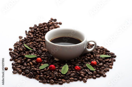 Cup with coffee and coffee beans