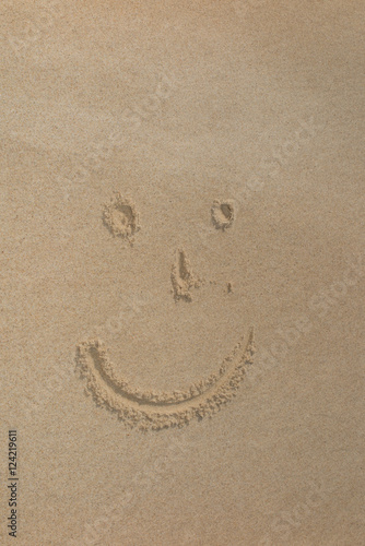 Smile face written in the sand on the beach © OceanProd