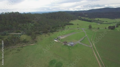 Forward flight towards Devil's Corner cellar door buildings in Tasmania, Australia photo