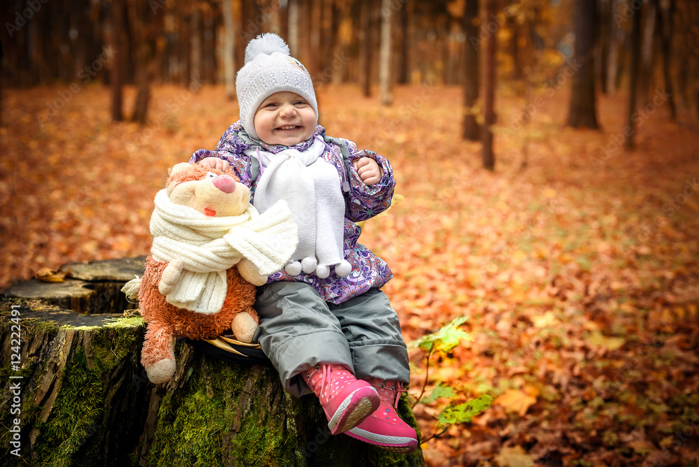 happy little child, baby girl laughing and playing in the autumn on the nature walk outdoors happy little child, baby girl laughing and playing in the autumn on the nature walk outdoors