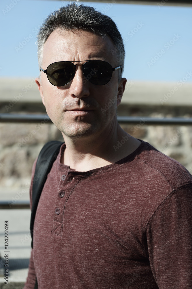 Urban portrait of handsome mid adult man over sea view, image to Urban portrait of handsome mid adult man over sea view, image to