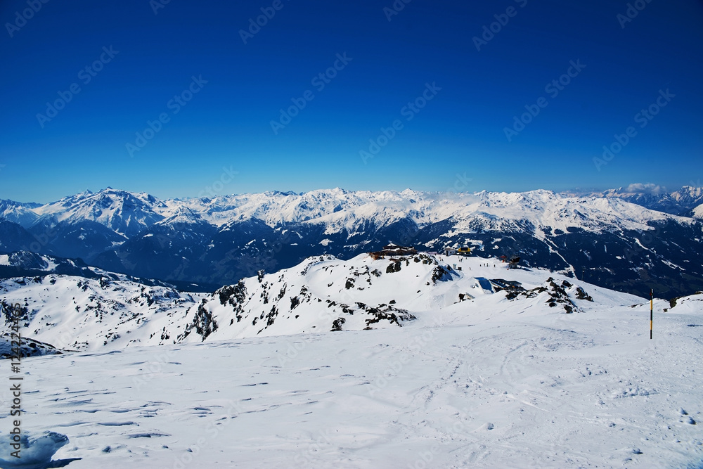 Snowy slopes in winter mountains. Skiing resorts