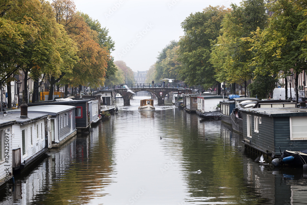 Houseboats in the canals of Amsterdam Houseboats in the canals of Amsterdam