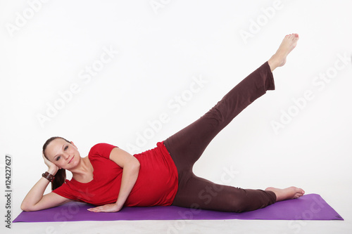 pregnant woman is doing yoga