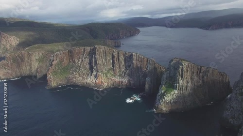 Flying towards the famous Totem Pole at Cape Hauy, Tasman National Park, Tasmania, Australia