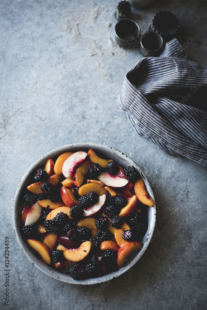 Peaches and blackberries in a mixing bowl Peaches and blackberries in a mixing bowl