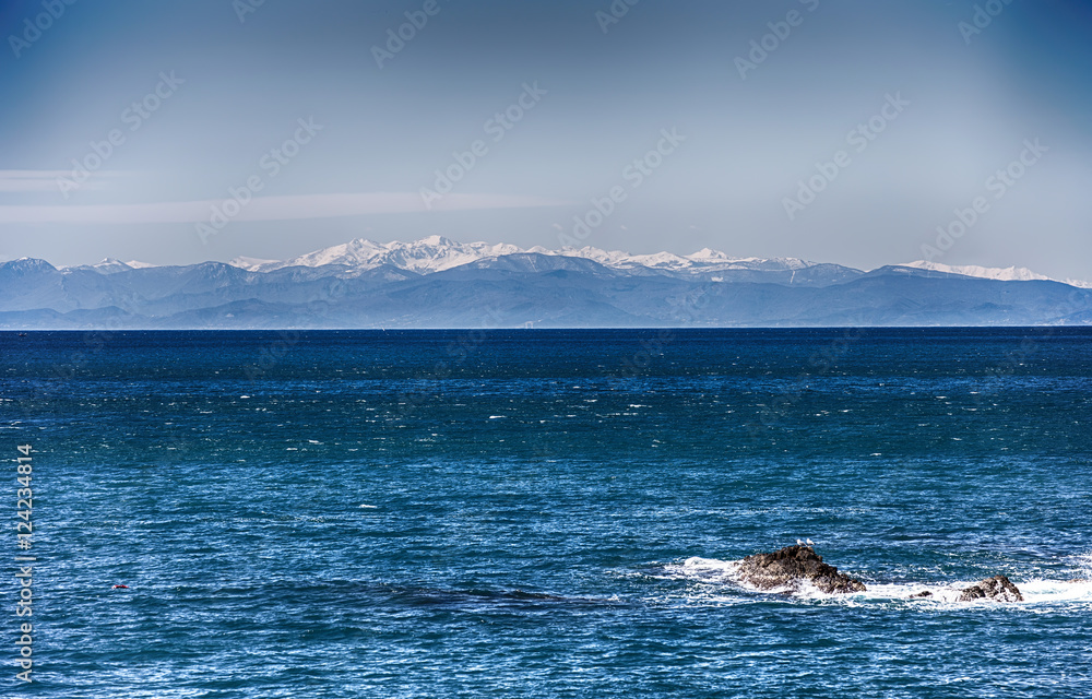 Sea with Mountains/ Ocean/ mountains/ snow/ wintertime/ blue/ white/ cold