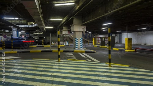 motion in underground parking of hypermarket ,shopping mall ,time lapse
