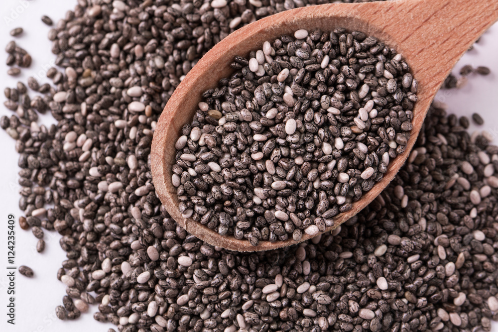 Chia seeds on wood background. Chia seeds protect heart,superfood. Healthy food Chia seeds on wood background. Chia seeds protect heart,superfood. Healthy food