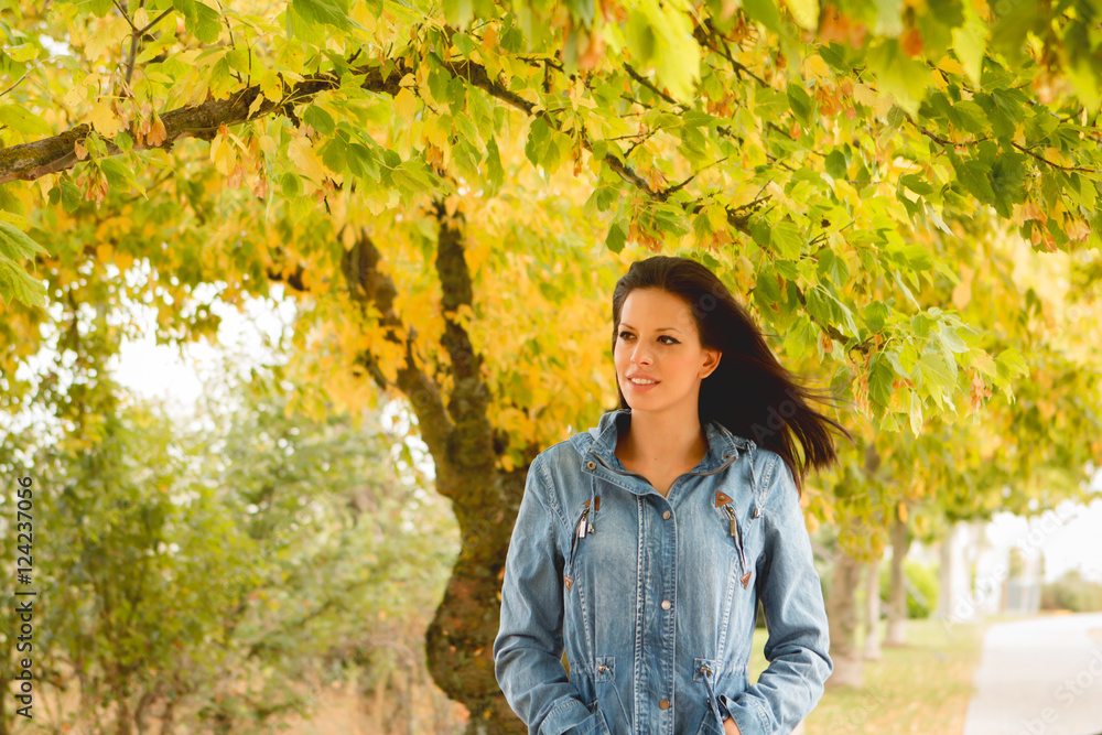 Beautiful brunette girl taking a walk in autumn Beautiful brunette girl taking a walk in autumn