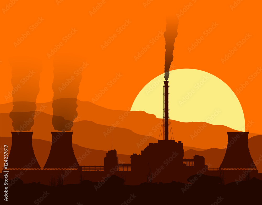 Silhouette of a nuclear power plant at sunset. 