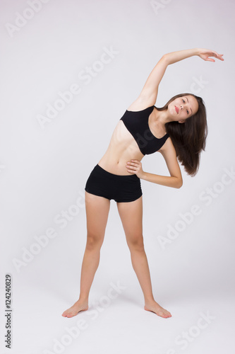 Girl doing workout on a white background