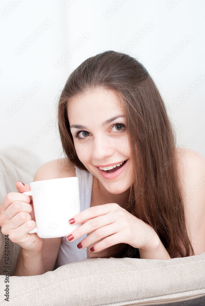Happy girl on the couch at home Happy girl on the couch at home