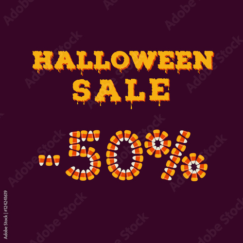 Halloween sale minus fifty percents inscription typography made of small candy corns. Holiday trick or treat concept