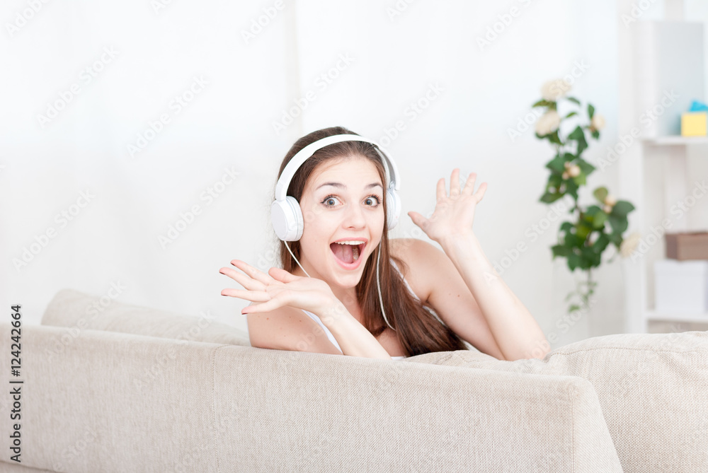 Happy girl on the couch at home Happy girl on the couch at home