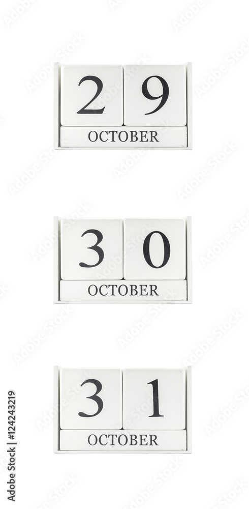 Closeup group of white wooden calendar with black 29 , 30 , 31 october word , three date calendar isolated on white background Closeup group of white wooden calendar with black 29 , 30 , 31 october word , three date calendar isolated on white background