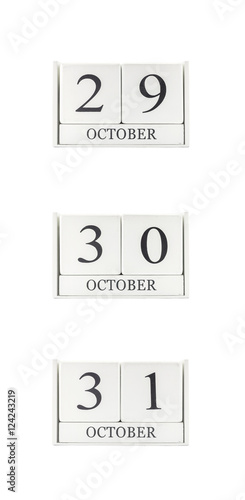 Closeup group of white wooden calendar with black 29 , 30 , 31 october word , three date calendar isolated on white background