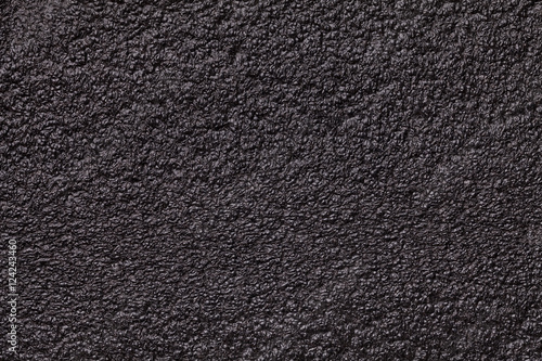 Black glossy background foam closeup. Texture of the rubber construction material